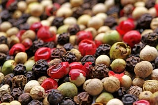 Different types of pepper kernels mixed and creating a landscape