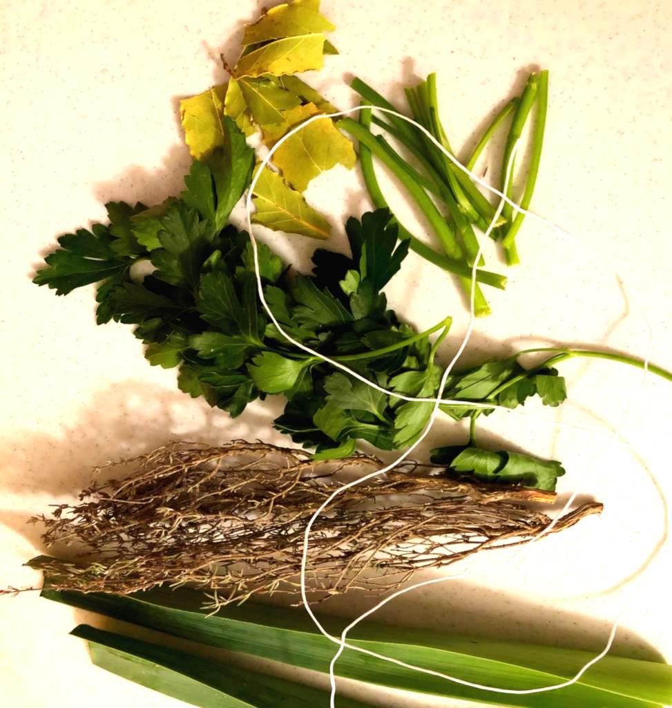 Bouquet garni ingredients: thyme, bay laurel, leek greens, parsley, rosemary (not shown).